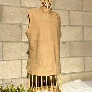 Dressy turtleneck top with wavy pattern in a warm tan gold colour​​​​​​​​​​​​​​​